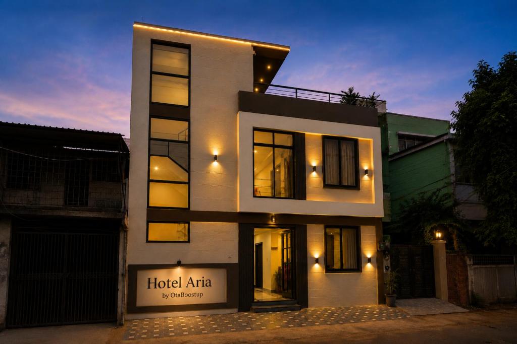 a large white building with a sign in front of it at Hotel Aria Bhopal Near AIIMS Hospital & Rani Kamlapati Station in Bhopal
