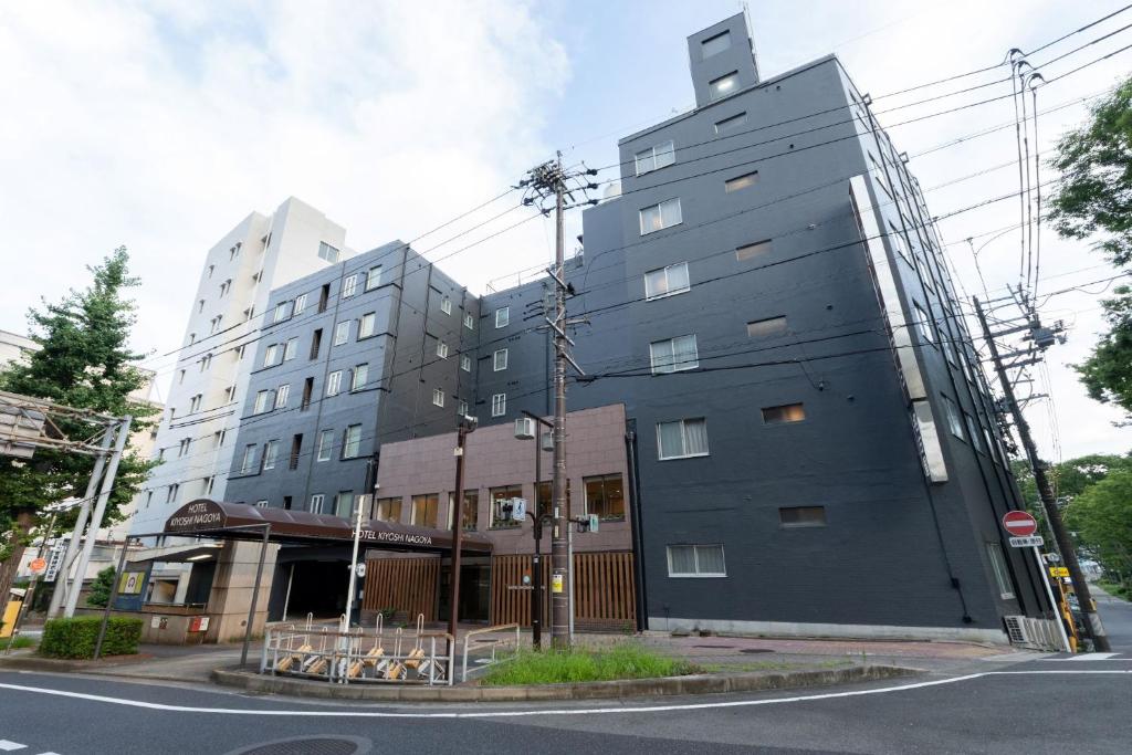 a building on the corner of a street at Hotel Kiyoshi Nagoya in Nagoya