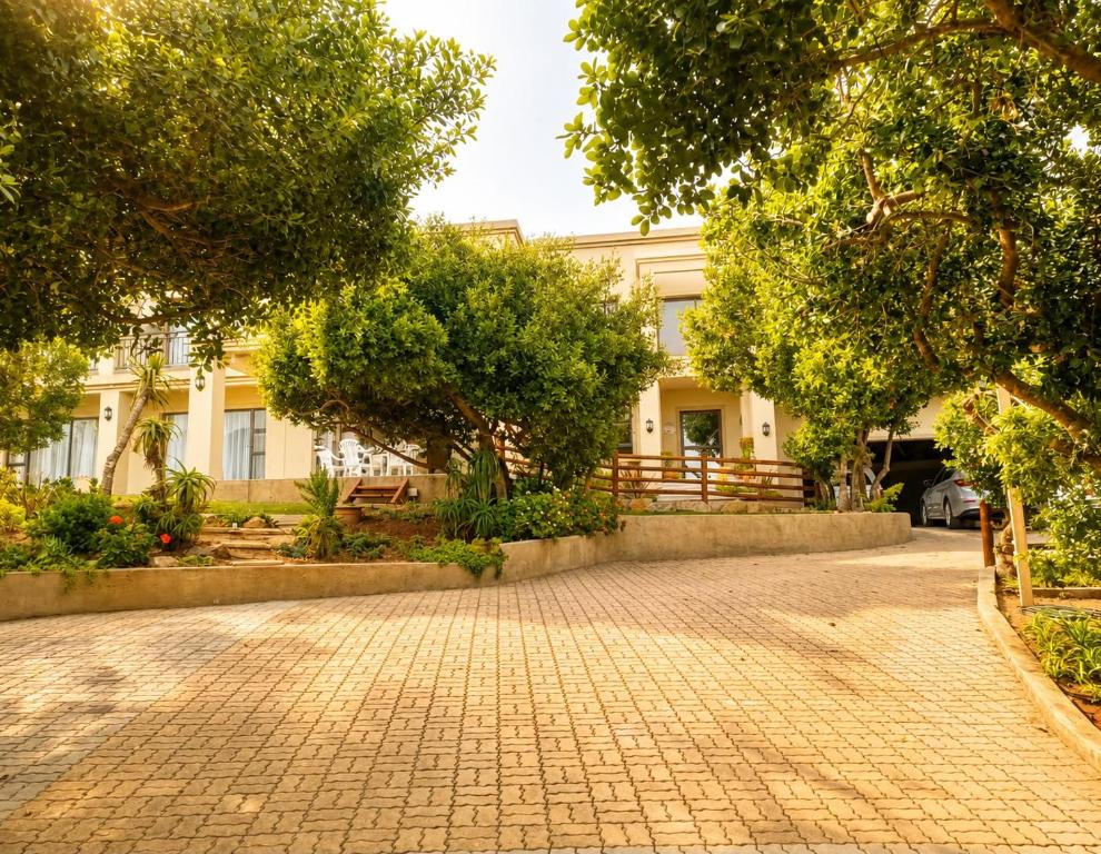 a cobblestone street in front of a building at On Appointment at the Sea in Wilderness