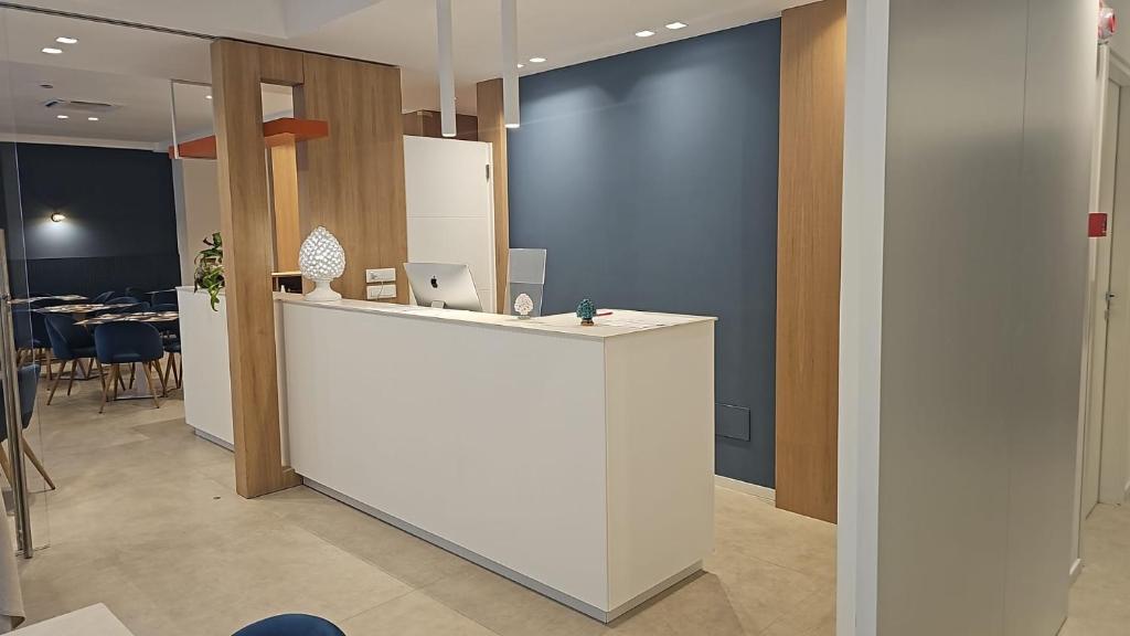 an office with a white counter and a table at Hotel Fernanda in Letojanni