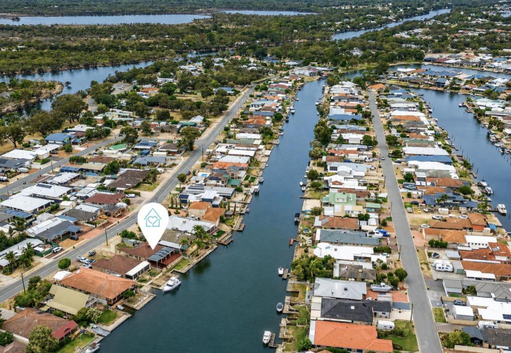 an aerial view of a city with houses and a river at Canal escape with private jetty and huge deck in South Yunderup