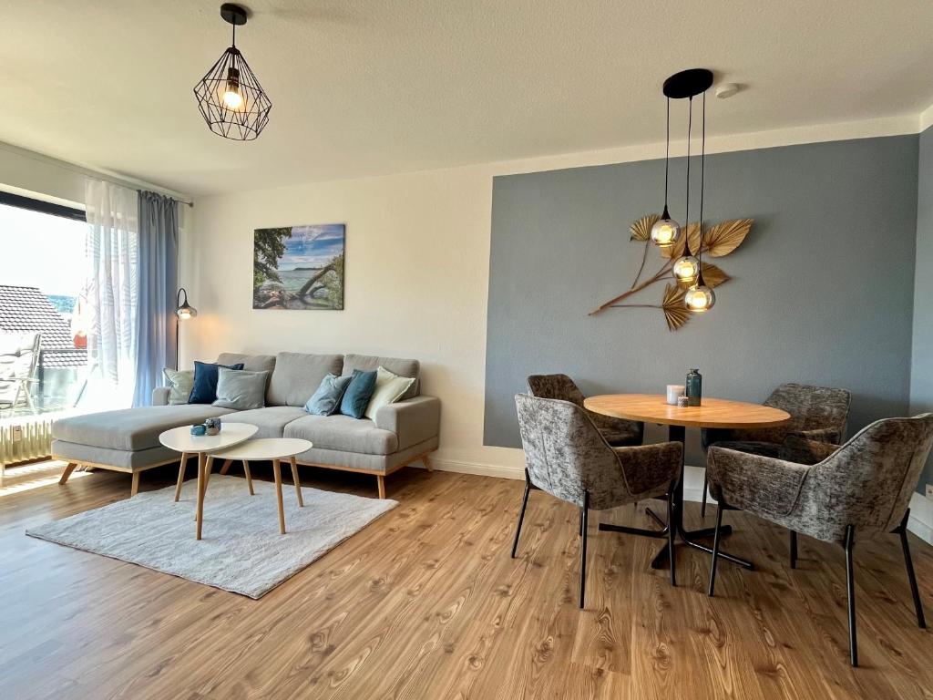 a living room with a couch and a table at See Apart 7 in Öhningen