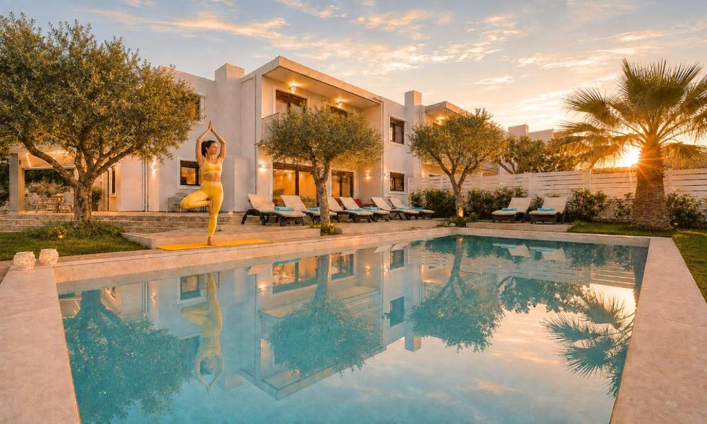 a swimming pool in front of a house at Sunlight Villas Heated Pool in Mathés