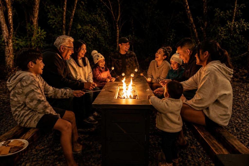 a group of people sitting around a table with lit candles at Stop Looking You've found it in Volcano