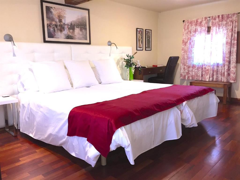 Postel nebo postele na pokoji v ubytování Hotel Del Lago