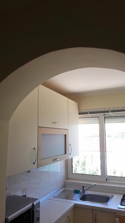 Kuchyň nebo kuchyňský kout v ubytování Apartments Feniks