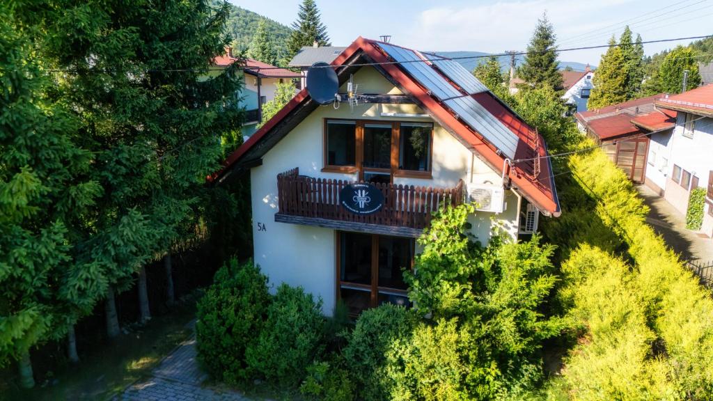 an aerial view of a house with a balcony at Ski House Szczyrk - Centrum in Szczyrk