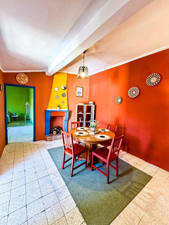 a dining room with a table and chairs at Wayra Glider Norma Centro in Norma