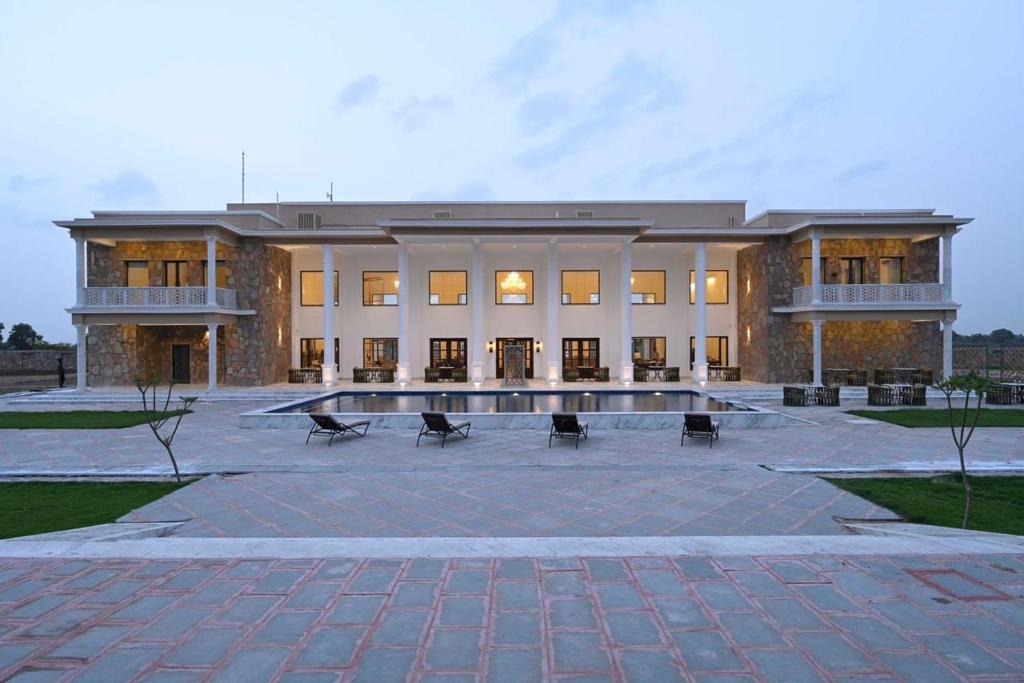 a large building with benches in front of it at Hari Bagh Jawai in Bijāpur