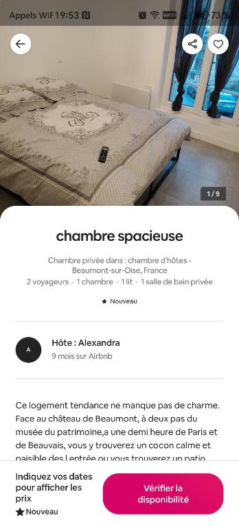 a screenshot of a webpage of a bed in a room at studio neuf in Beaumont-sur-Oise