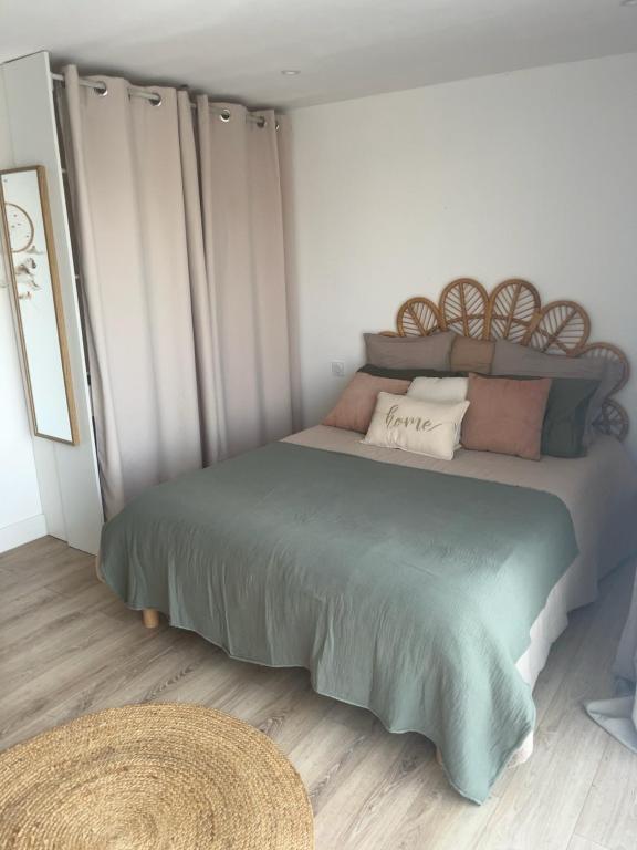 a bedroom with a bed with pillows on it at À Casarella di Lisa in Vescovato