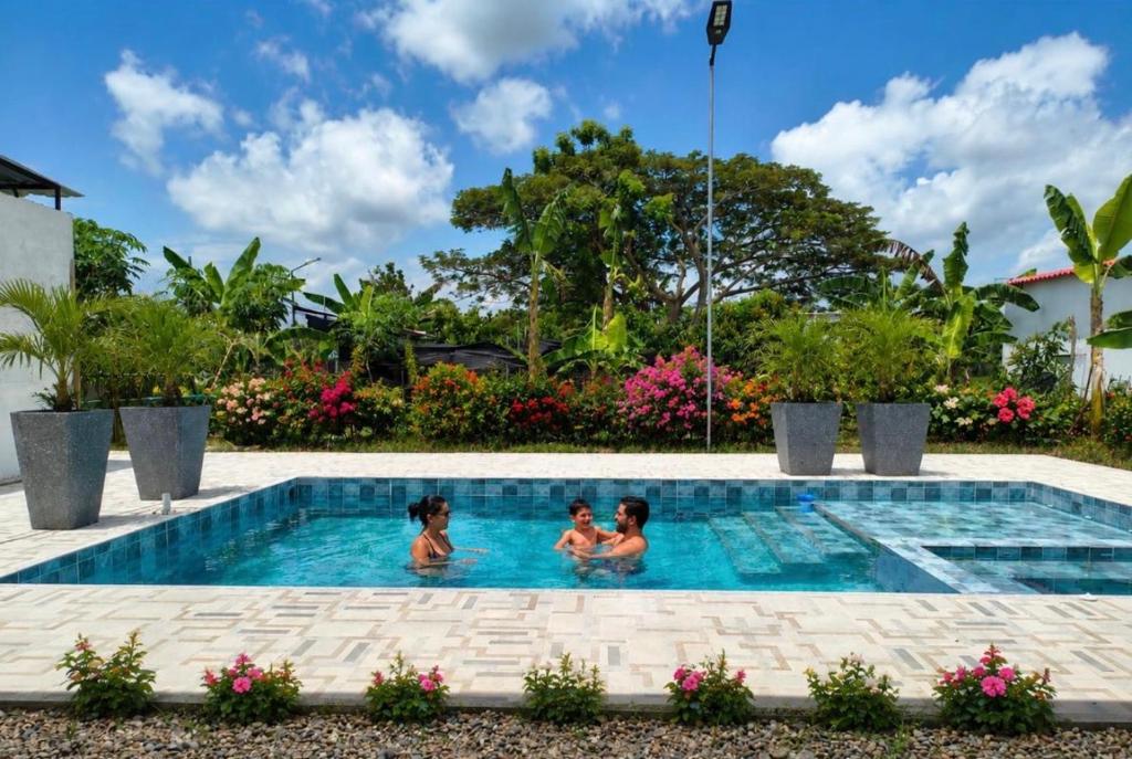 two children in the swimming pool at a resort at Diamante 38 in La Dorada