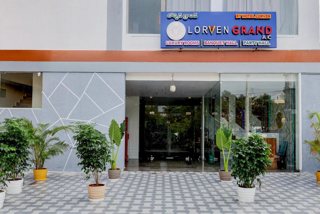 a group of potted plants in front of a store at Super Collection O Lorven Grand in Visakhapatnam