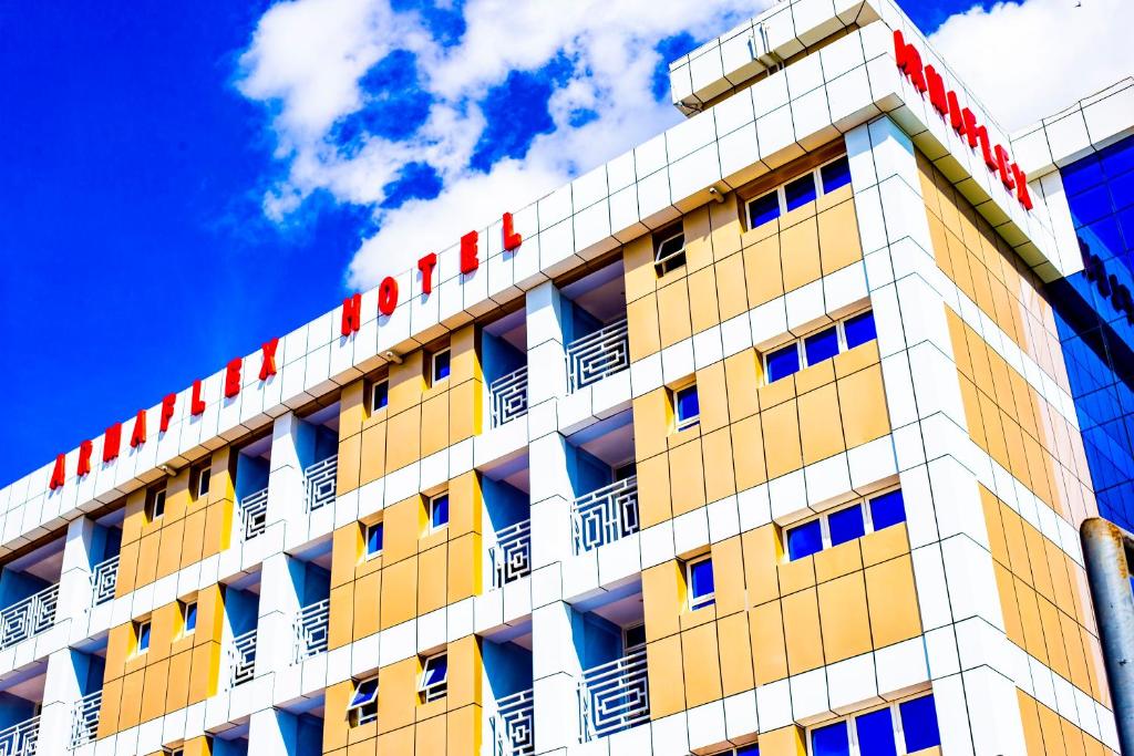 a building with a hotel sign on top of it at Armaflex hotel SMC LTD in Lira