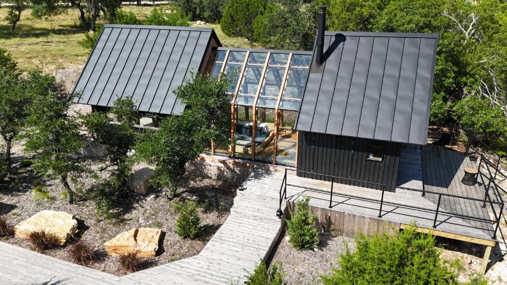 an aerial view of a house with a solarium at Lagom Retreat in Dripping Springs
