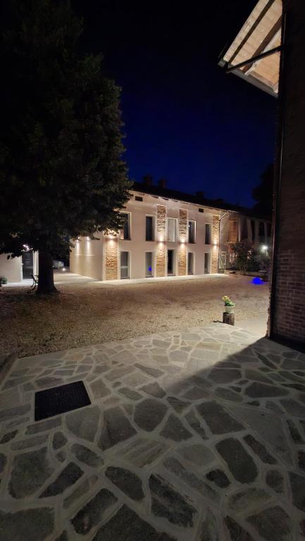 an outside view of a building at night at San Lorenzo Suite in Tigliole