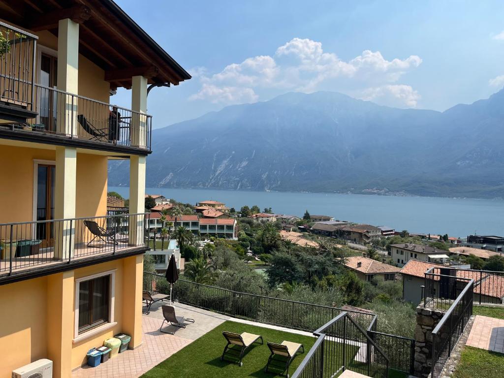 a balcony of a building with a view of a lake at Villa Imelda, panoramic apartments with Lake Garda views in Limone sul Garda