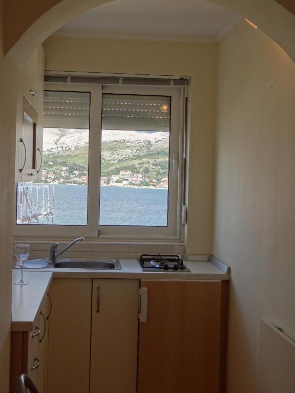 Kuchyň nebo kuchyňský kout v ubytování Apartments Feniks