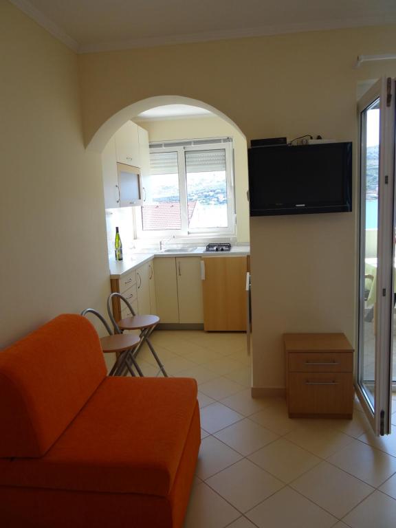TV a/nebo společenská místnost v ubytování Apartments Feniks