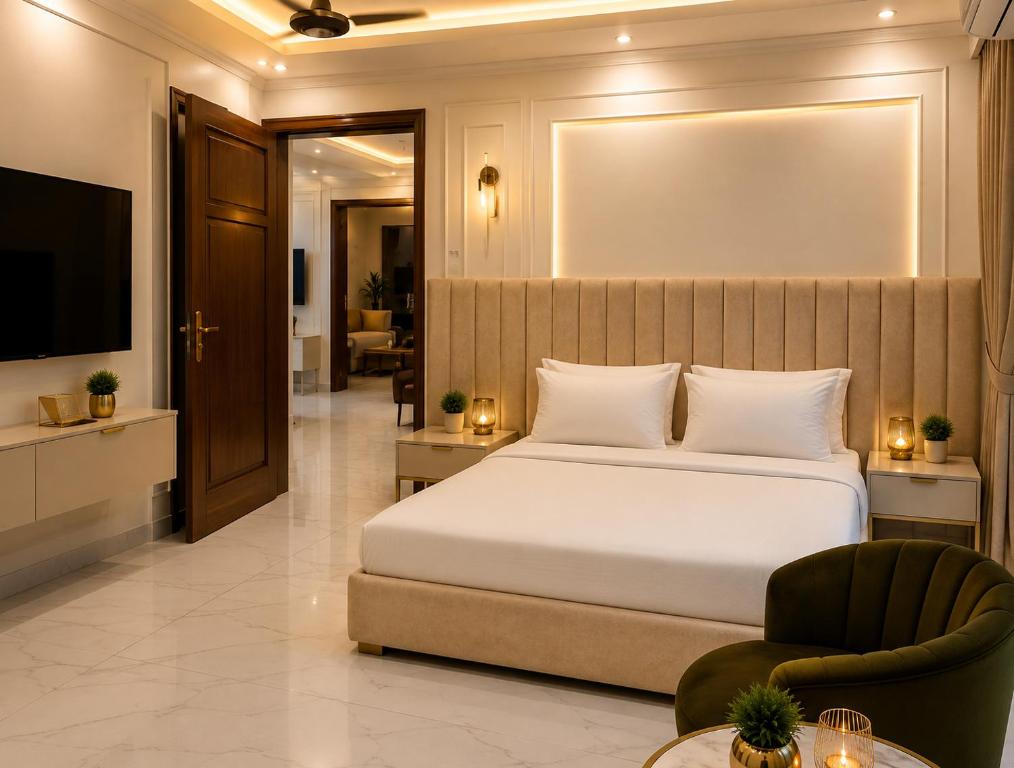 a bedroom with a large bed and a television at Emerald Villa Islamabad in Islamabad