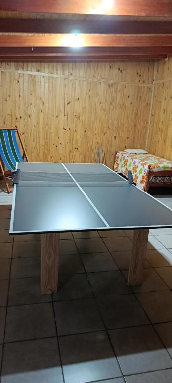a ping pong table sitting in a room with at Cabaña Don Jorge in Puerto Rico