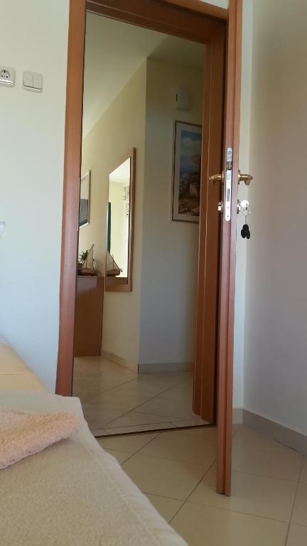 Postel nebo postele na pokoji v ubytování Apartments Feniks