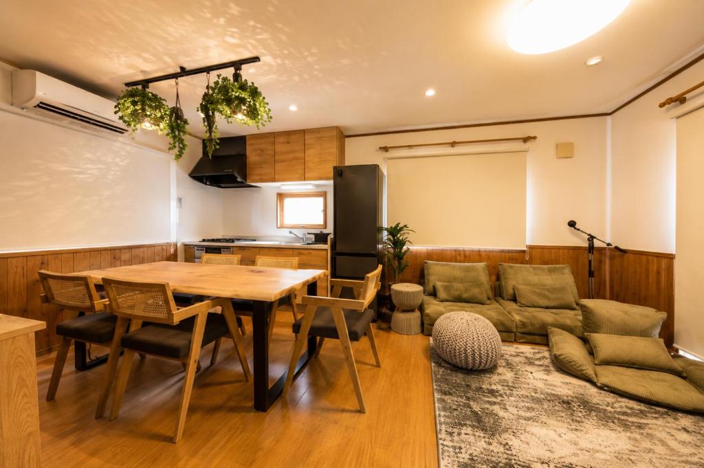 a living room with a table and a couch at BLUEBAY TERRACE okutama in Okutama