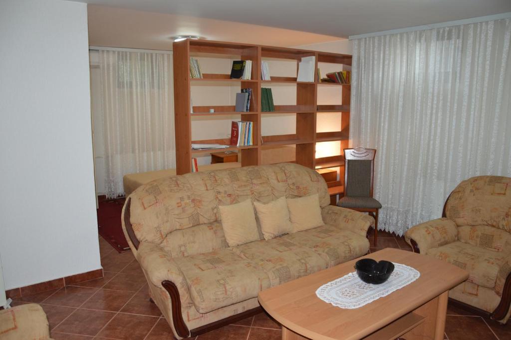 a living room with a couch and a coffee table at Villa Stella Smederevo in Smederevo