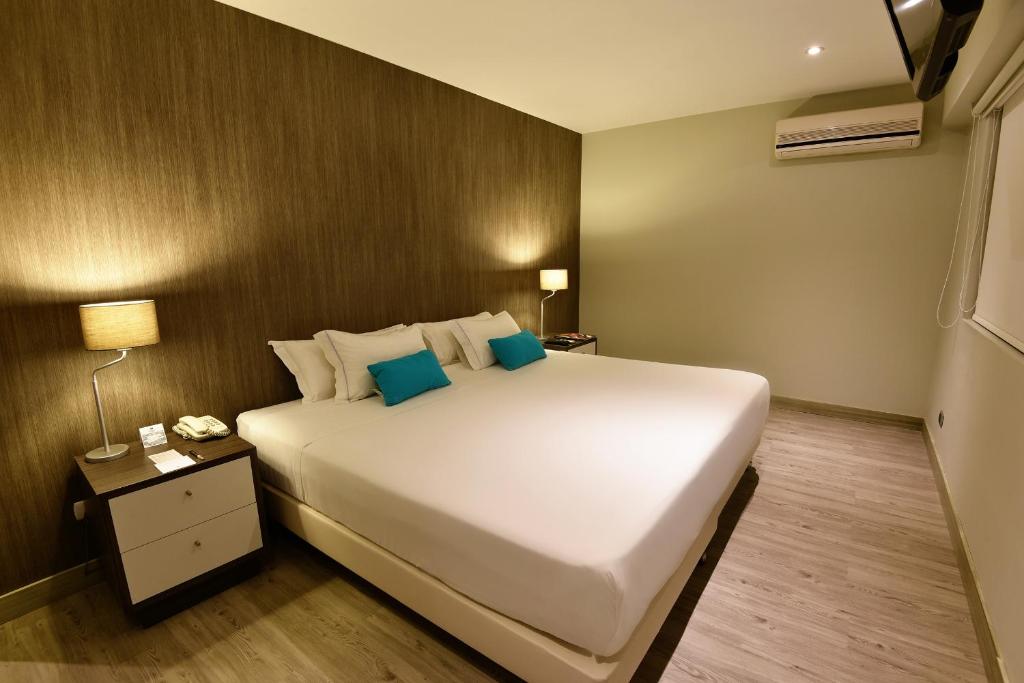 Llit o llits en una habitació de Mariel Hotel Boutique