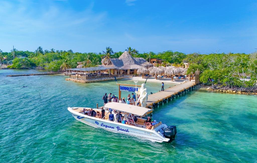 a group of people on a boat in the water at Tritonia Island Tintipán in Tolú