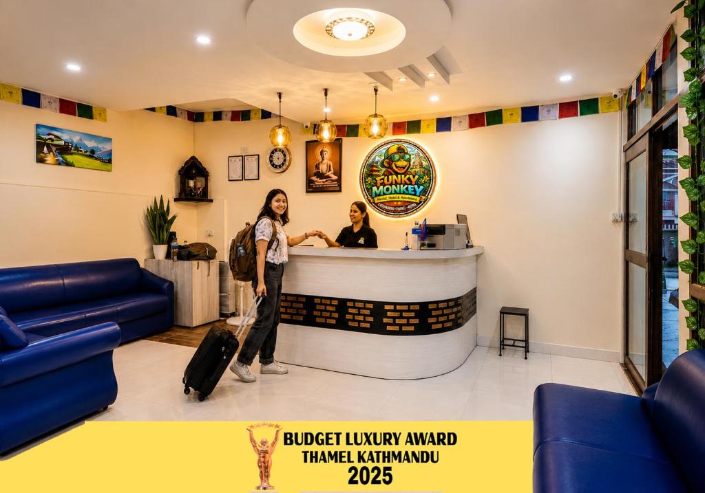 two women standing at a bar in a restaurant at FUNKY MONKEY- A Hostel, Hotel and Apartment in Kathmandu