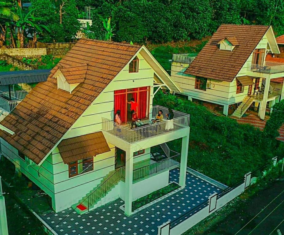 a model of a house with a red door at Villas NEST Athirappilly in Athirappilly