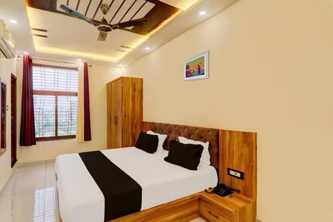 a bedroom with a large bed in a room at Hotel manyam palace in Gorakhpur