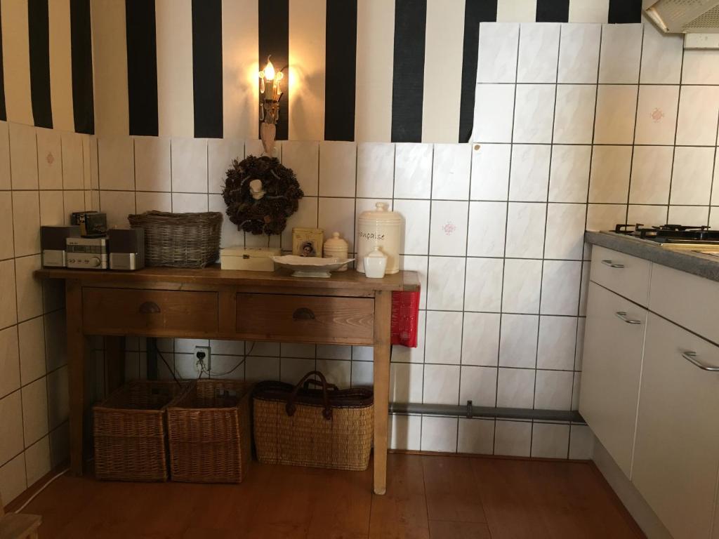 Kuchyň nebo kuchyňský kout v ubytování La Perle Apartment