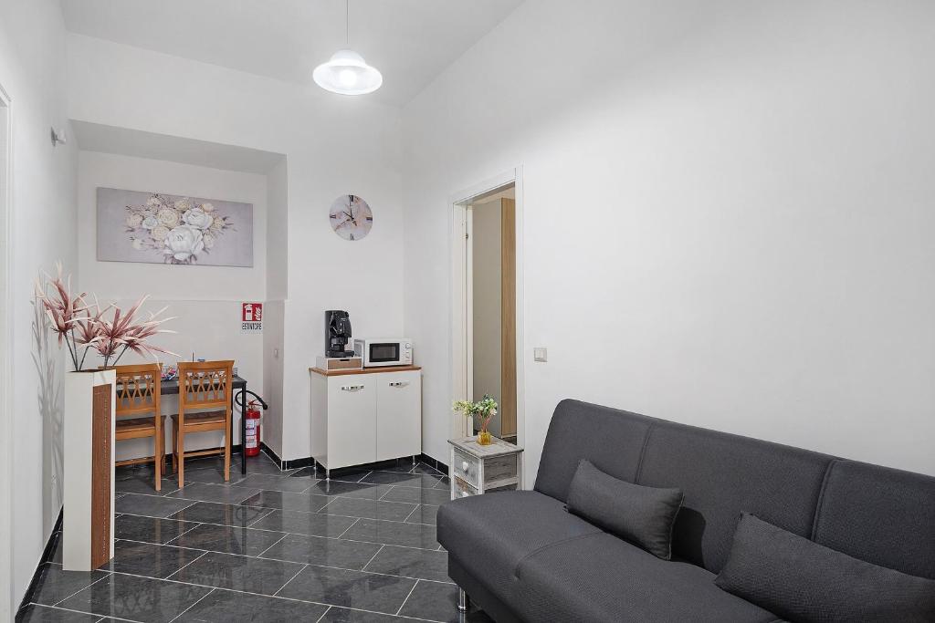 a living room with a couch and a table at Tre Corone - Sarno in Sarno