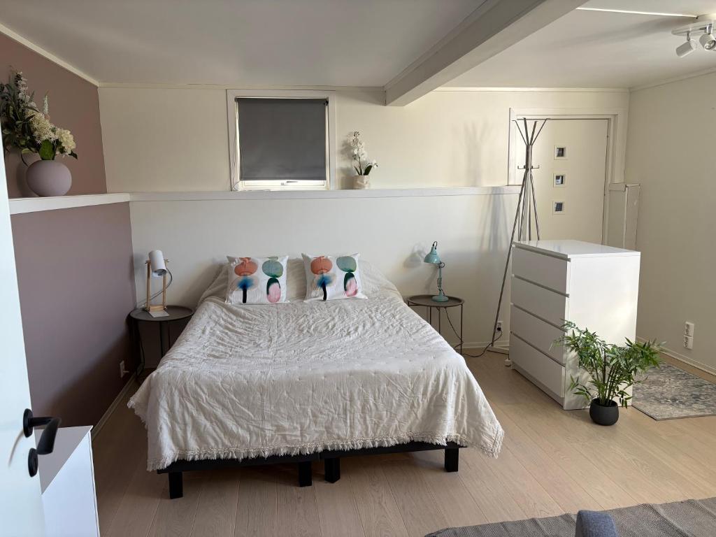 a bedroom with a bed with vases on it at Northern Suite in Tromsø