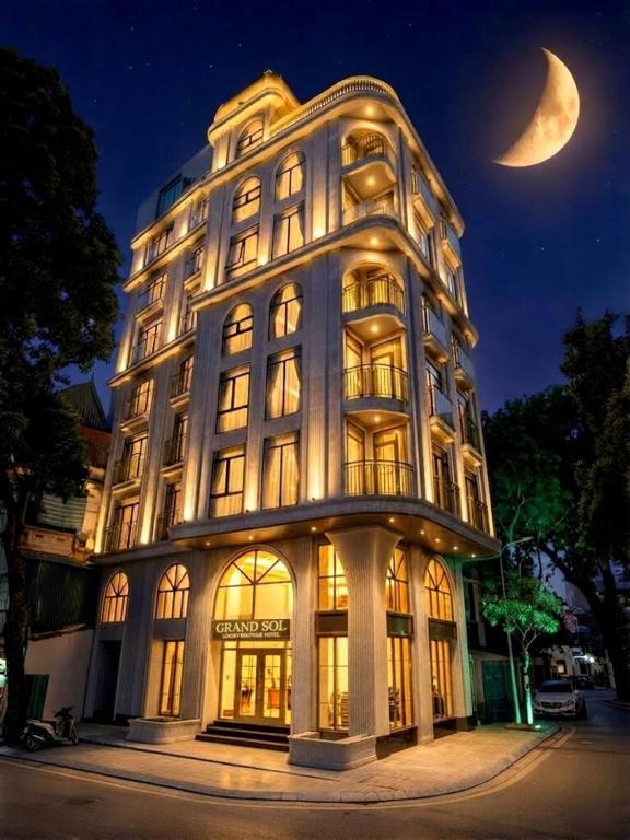 a large building with a crescent moon in the sky at GRAND SOL LUXURY BOUTIQUE Hotel in Hanoi