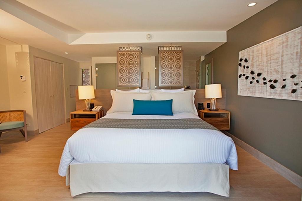 Voodi või voodid majutusasutuse Secrets Papagayo All Inclusive - Adults Only toas