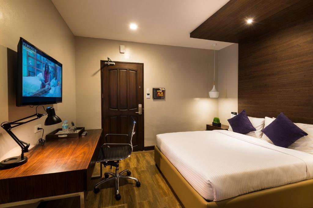 TV a/nebo společenská místnost v ubytování Lenox Hotel