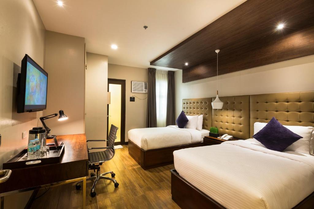 מיטה או מיטות בחדר ב-Lenox Hotel