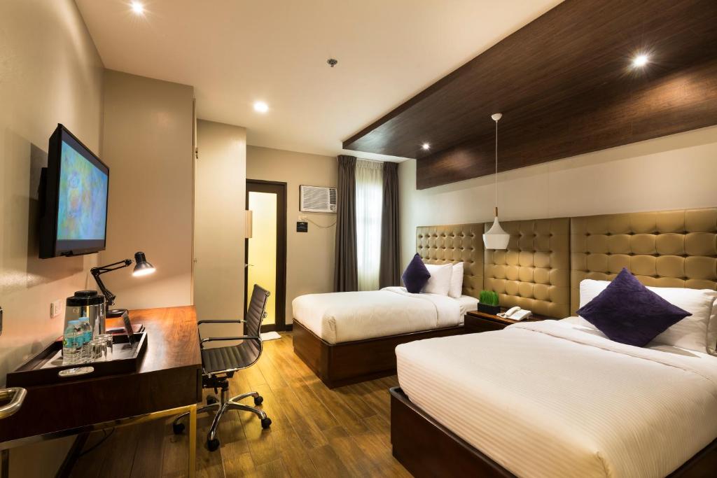Postel nebo postele na pokoji v ubytování Lenox Hotel