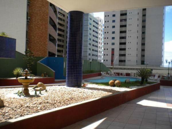 a courtyard with a fire hydrant and some buildings at Porto de Iracema in Fortaleza