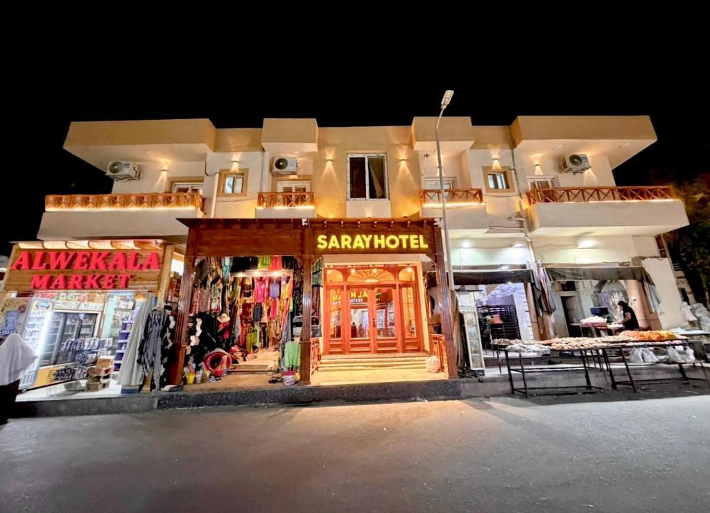 a store front of a shopping center at night at Saray Hotel Dahab in Dahab