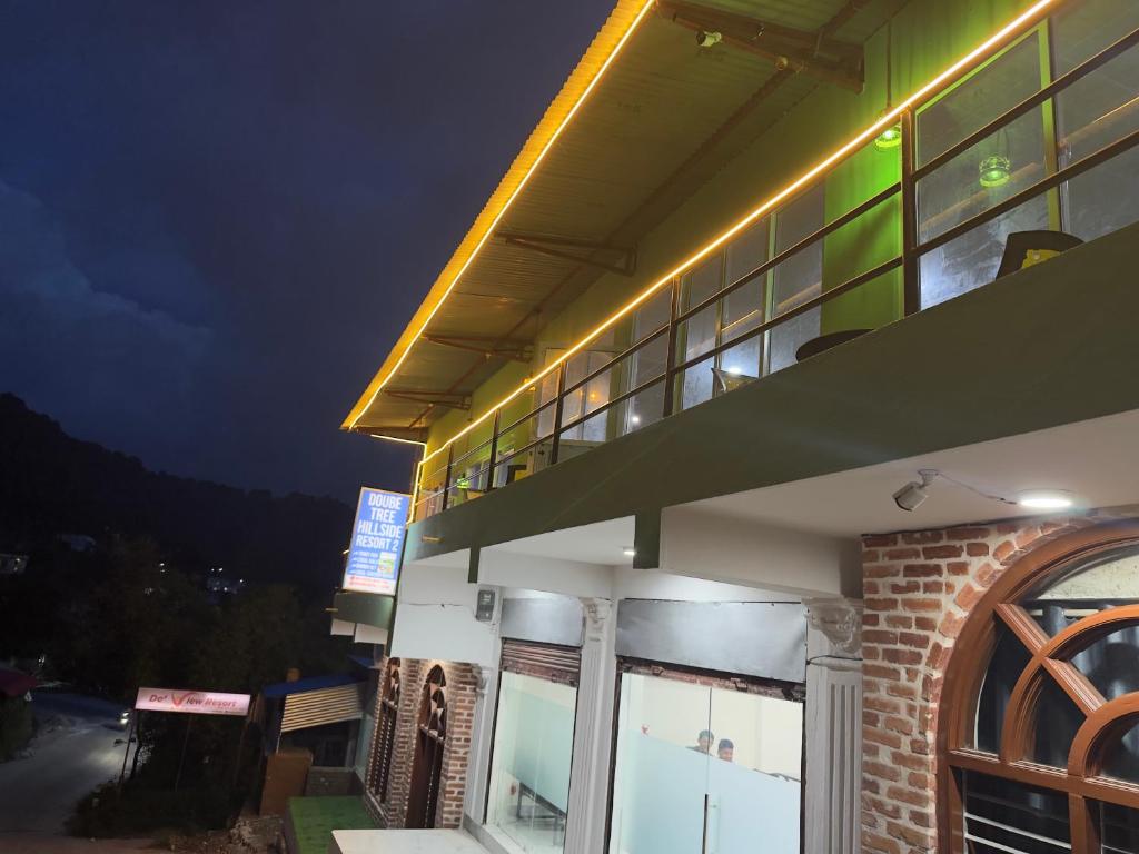 a building with a light on top of it at night at Double tree hill side resort 2 in Burhānilkantha