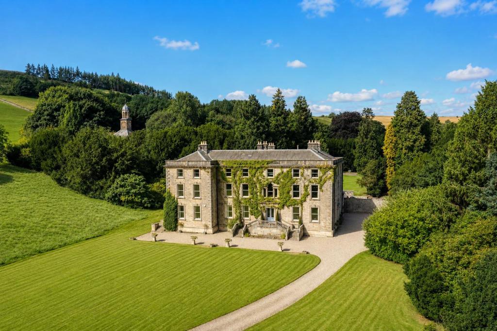 an aerial view of a house with a garden at Marske Hall, Yorkshire Dales in Marske