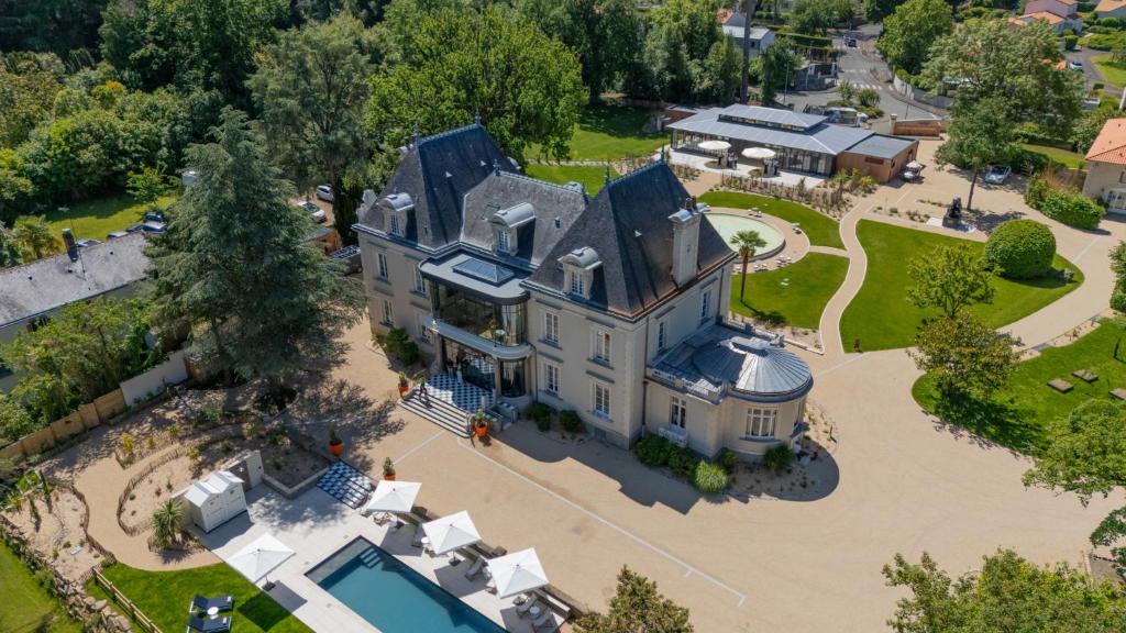 an aerial view of a large house with a pool at Château du Portereau in Vertou
