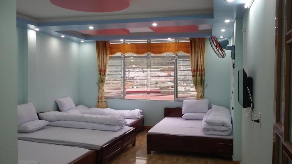 Postel nebo postele na pokoji v ubytování Binh Minh Hostel
