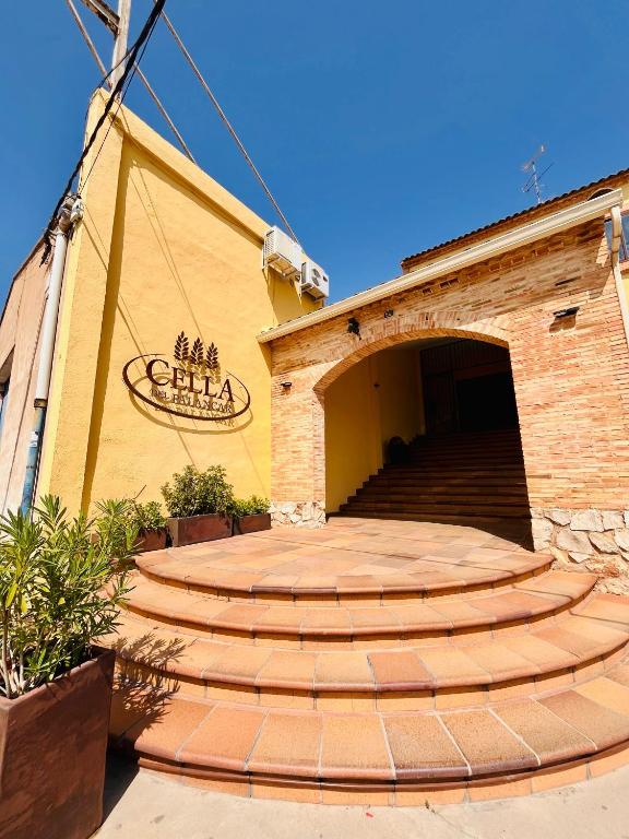 a building with a set of stairs in front at Cella del Palancar in Motilla del Palancar