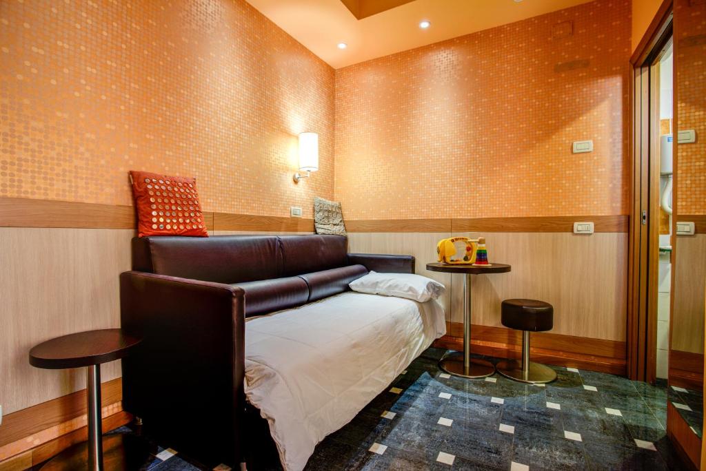 Postel nebo postele na pokoji v ubytování Hotel Genty