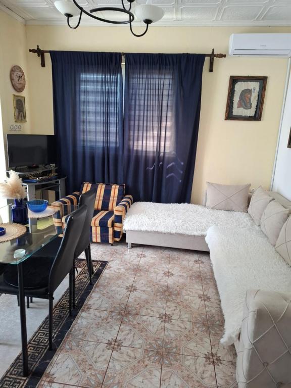 a living room with a bed and a table at Dukii in Vrnjci
